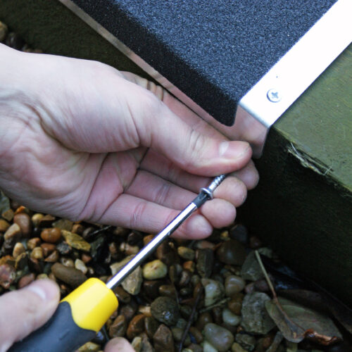 H3409-120mm-x-45mm-x-635mm-L-Shape-Bolt-Down-Anti-Slip-Plate-Being-Applied-to-Stairs-1.jpg
