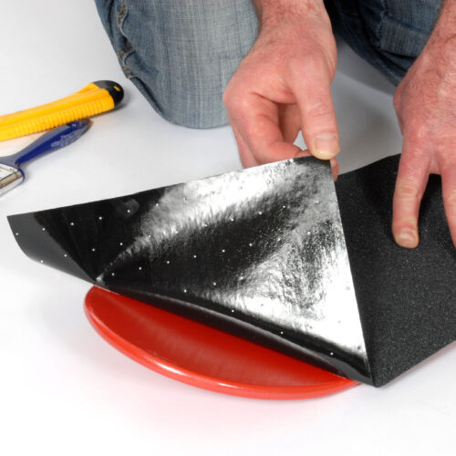 H3422-Skateboard-Grip-Tape-Aerated-Carbide-Being-Applied-to-Skateboard-2.jpg